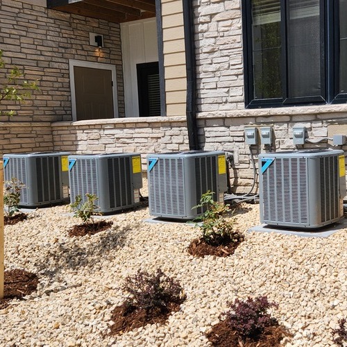 a row of commercial air conditioner units